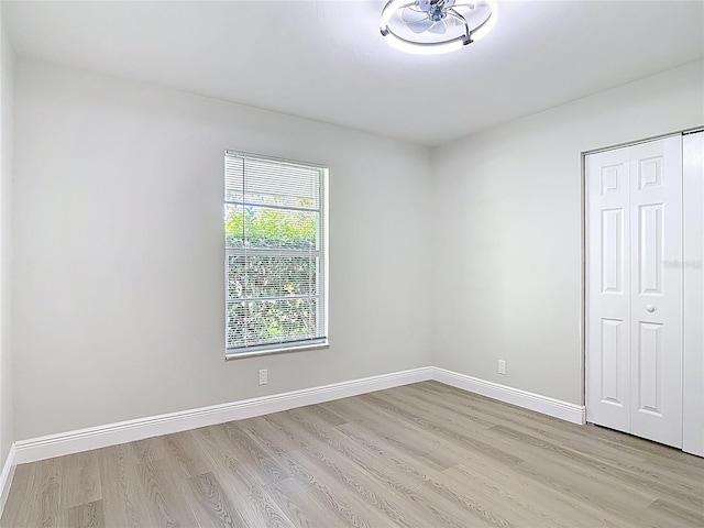1019 Chippewa Trl, Daytona Beach, FL 32117 - unfurnished bedroom featuring light wood-style floors and a closet