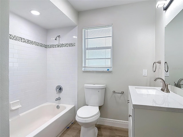 1019 Chippewa Trl, Daytona Beach, FL 32117 - bathroom featuring vanity, wood finished floors, and shower / tub combination