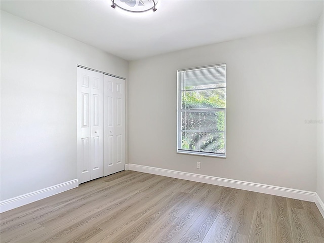 1019 Chippewa Trl, Daytona Beach, FL 32117 - unfurnished bedroom with light wood-style floors and a closet