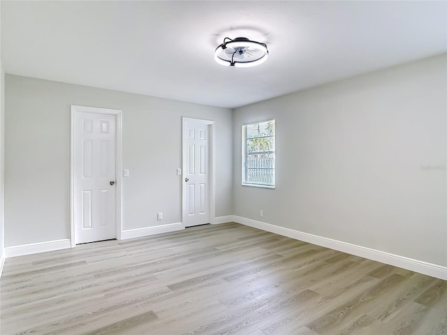 1019 Chippewa Trl, Daytona Beach, FL 32117 - unfurnished bedroom with light wood-style flooring and baseboards