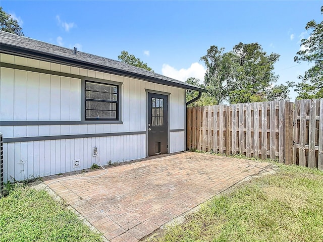 1019 Chippewa Trl, Daytona Beach, FL 32117 - doorway to property featuring a patio area and roof with shingles