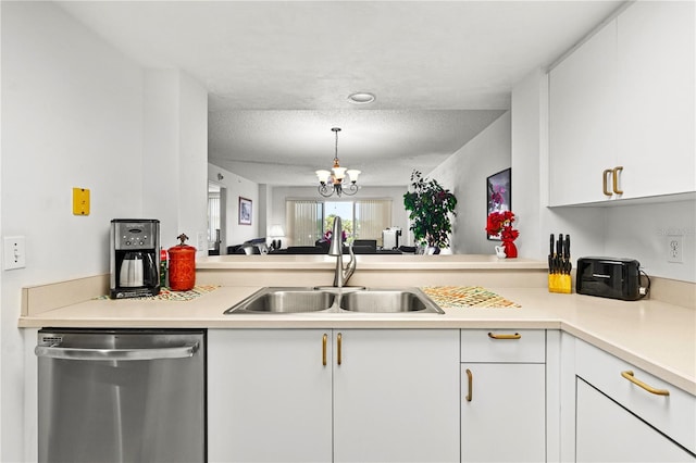 3 Oceans W Blvd Unit 3A7, Daytona Beach Shores, FL 32118 - kitchen featuring stainless steel dishwasher, light countertops, a chandelier, white cabinets, and a textured ceiling