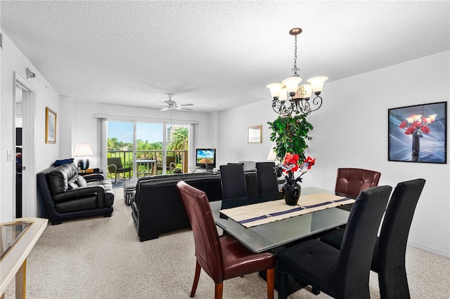 3 Oceans W Blvd Unit 3A7, Daytona Beach Shores, FL 32118 - dining space with a textured ceiling, a chandelier, a ceiling fan, and light carpet
