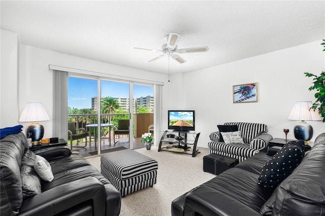 3 Oceans W Blvd Unit 3A7, Daytona Beach Shores, FL 32118 - living area with a ceiling fan and a textured ceiling