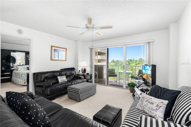 3 Oceans W Blvd Unit 3A7, Daytona Beach Shores, FL 32118 - carpeted living area with a ceiling fan and a textured ceiling