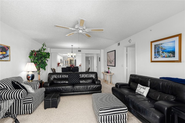 3 Oceans W Blvd Unit 3A7, Daytona Beach Shores, FL 32118 - living room with carpet floors, a chandelier, ceiling fan, and a textured ceiling