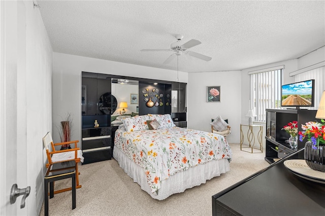 3 Oceans W Blvd Unit 3A7, Daytona Beach Shores, FL 32118 - carpeted bedroom featuring a textured ceiling and ceiling fan