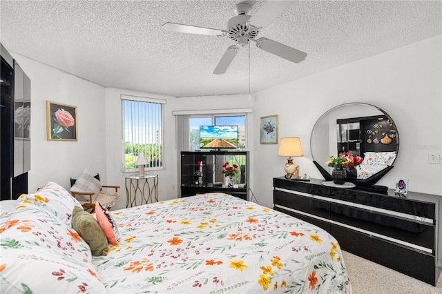 3 Oceans W Blvd Unit 3A7, Daytona Beach Shores, FL 32118 - bedroom with a textured ceiling, a ceiling fan, and carpet floors