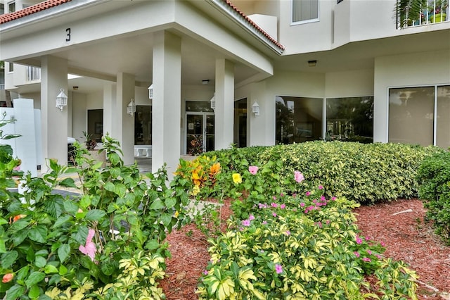 3 Oceans W Blvd Unit 3A7, Daytona Beach Shores, FL 32118 - doorway to property with stucco siding and a tile roof