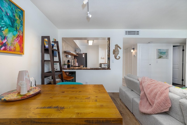 2800 N Atlantic Ave Unit 1409, Daytona Beach, FL 32118 - dining room featuring wood finished floors and baseboards