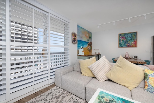 2800 N Atlantic Ave Unit 1409, Daytona Beach, FL 32118 - living room with rail lighting and wood finished floors