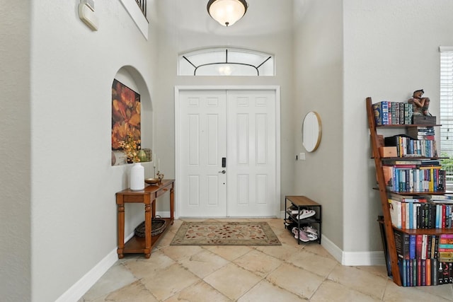 3842 Calliope Ave, Port Orange, FL 32129 - tiled entryway with a high ceiling and baseboards