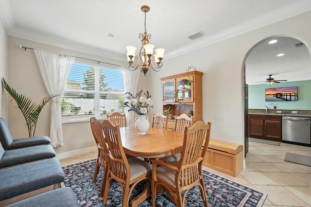 3842 Calliope Ave, Port Orange, FL 32129 - dining room with arched walkways, ornamental molding, a chandelier, light tile patterned flooring, and ceiling fan