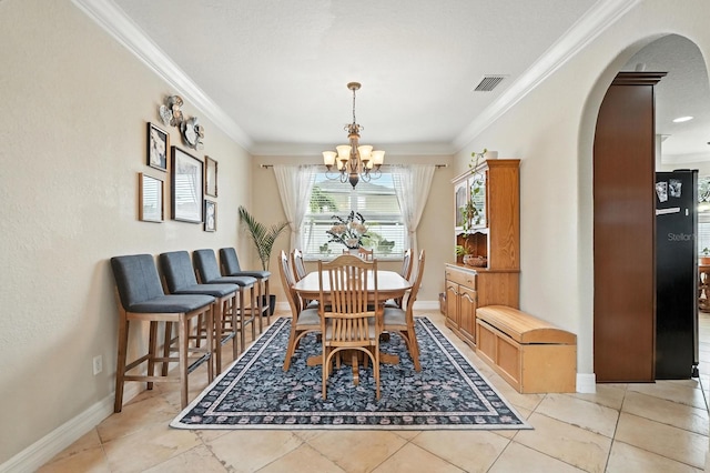 3842 Calliope Ave, Port Orange, FL 32129 - dining area with arched walkways, a chandelier, and ornamental molding