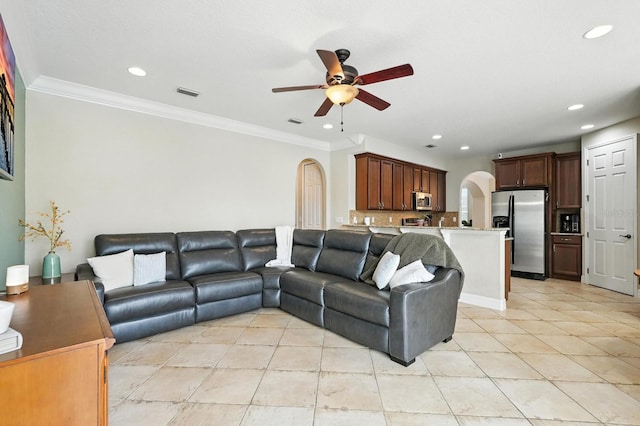 3842 Calliope Ave, Port Orange, FL 32129 - living area featuring arched walkways, a ceiling fan, light tile patterned floors, recessed lighting, and crown molding