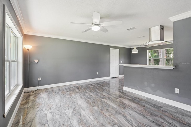 330 Ponce Deleon Blvd, De Leon Springs, FL 32130 - unfurnished room with crown molding, ceiling fan, marble look tile flooring, and a textured ceiling