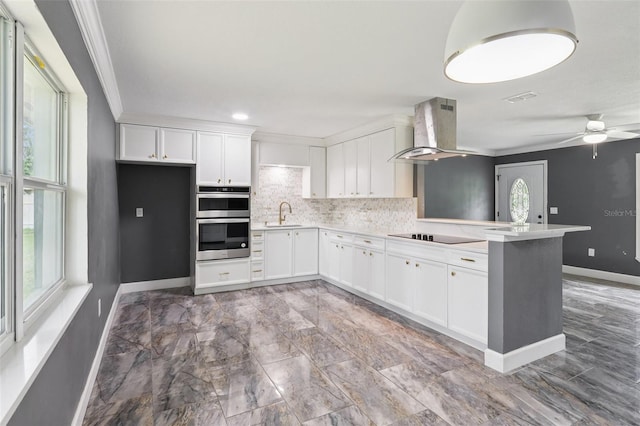 330 Ponce Deleon Blvd, De Leon Springs, FL 32130 - kitchen featuring exhaust hood, double oven, a peninsula, ornamental molding, and tasteful backsplash