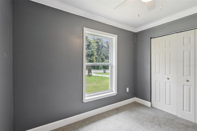 330 Ponce Deleon Blvd, De Leon Springs, FL 32130 - unfurnished bedroom featuring ornamental molding, carpet flooring, a closet, and a ceiling fan