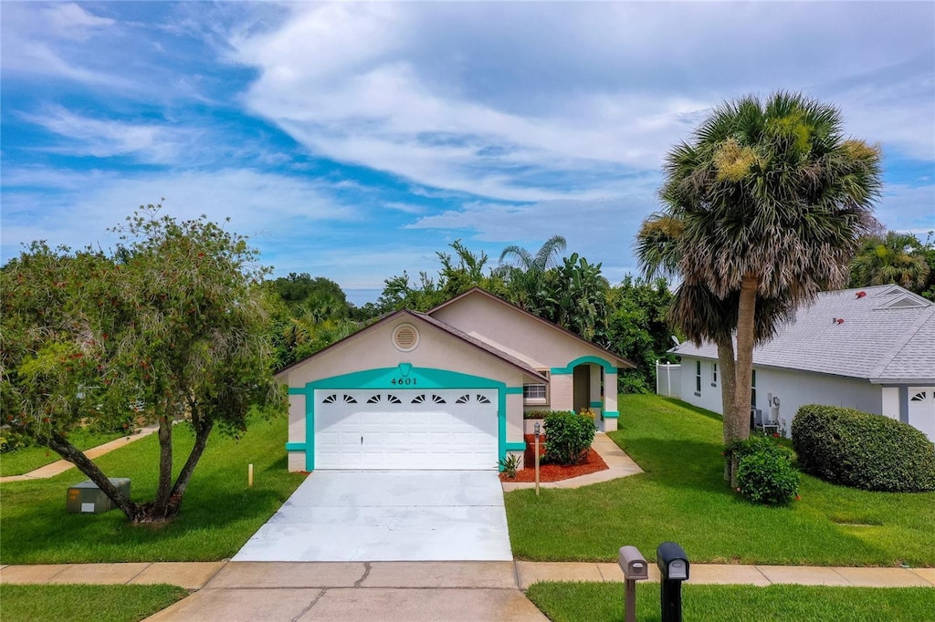 4601 Barnacle Dr, Port Orange, FL 32127 - single story home featuring a front yard, a garage, and concrete driveway