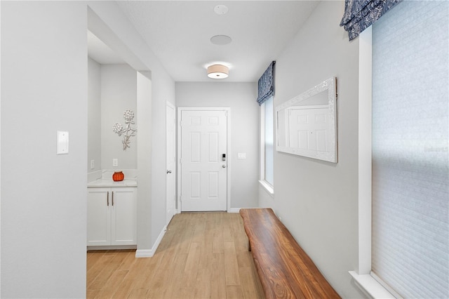 2807 Priego Blvd, Kissimmee, FL 34744 - hall featuring light wood finished floors and baseboards