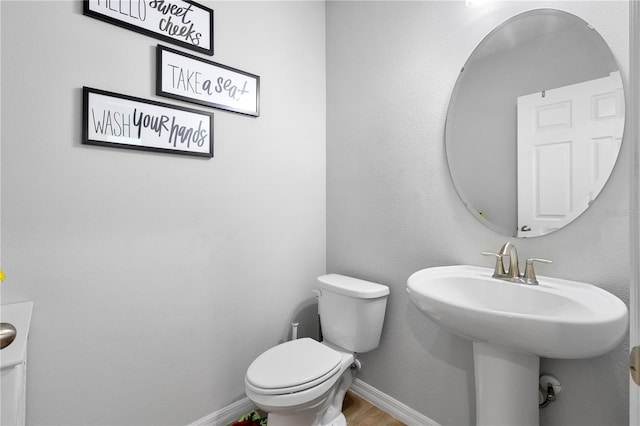 2807 Priego Blvd, Kissimmee, FL 34744 - bathroom with toilet and wood finished floors