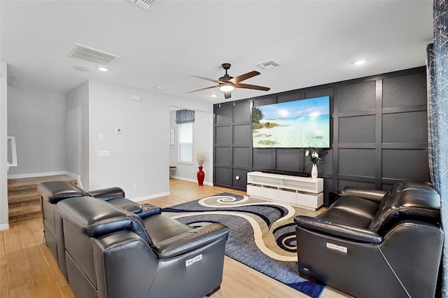 2807 Priego Blvd, Kissimmee, FL 34744 - cinema with a decorative wall, light wood-style floors, ceiling fan, and recessed lighting