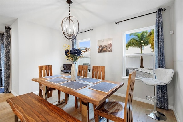 2807 Priego Blvd, Kissimmee, FL 34744 - dining area with a chandelier and light wood-style flooring