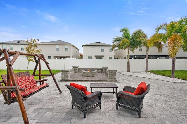2807 Priego Blvd, Kissimmee, FL 34744 - fenced backyard featuring an outdoor fire pit, a patio, and a residential view
