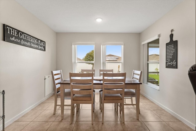 815 Fillmore Ct, Davenport, FL 33837 - dining space featuring light tile patterned flooring and baseboards