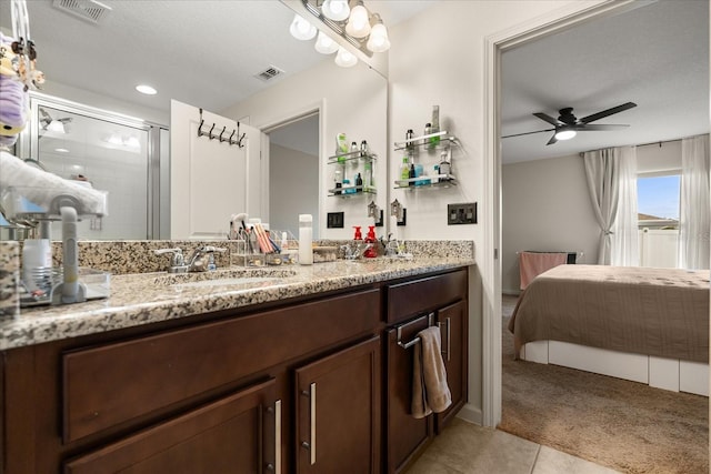 815 Fillmore Ct, Davenport, FL 33837 - bathroom with ensuite bath, vanity, a ceiling fan, tile patterned floors, and a shower stall