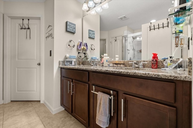815 Fillmore Ct, Davenport, FL 33837 - bathroom with double vanity, a stall shower, and tile patterned floors