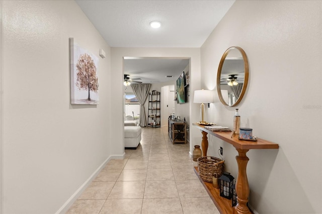 815 Fillmore Ct, Davenport, FL 33837 - corridor featuring light tile patterned floors and baseboards
