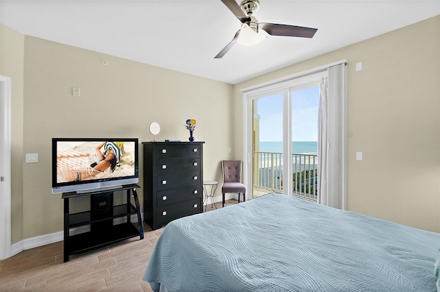 3343 S Atlantic Ave Unit 601, Daytona Beach Shores, FL 32118 - bedroom featuring wood finish floors, access to outside, and a ceiling fan