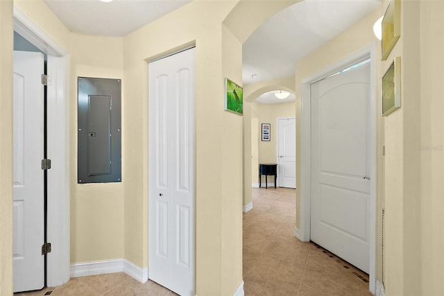 3343 S Atlantic Ave Unit 601, Daytona Beach Shores, FL 32118 - hall featuring electric panel, arched walkways, and light tile patterned floors