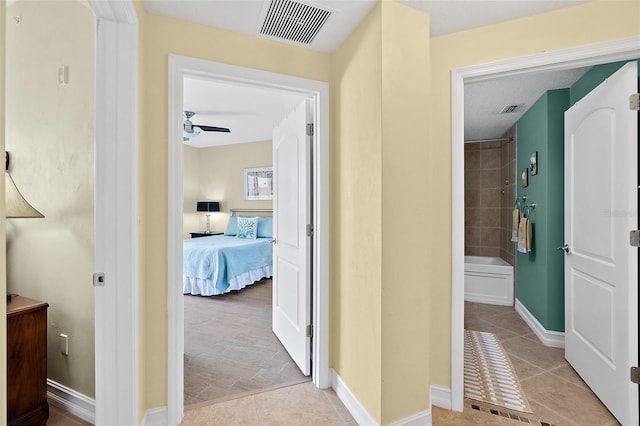 3343 S Atlantic Ave Unit 601, Daytona Beach Shores, FL 32118 - hallway featuring light tile patterned floors and baseboards