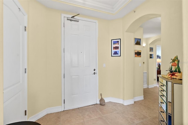 3343 S Atlantic Ave Unit 601, Daytona Beach Shores, FL 32118 - foyer featuring arched walkways, crown molding, and light tile patterned flooring