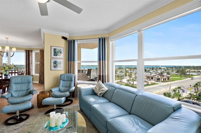 3343 S Atlantic Ave Unit 601, Daytona Beach Shores, FL 32118 - living area with a chandelier, a ceiling fan, ornamental molding, and carpet floors
