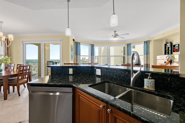 3343 S Atlantic Ave Unit 601, Daytona Beach Shores, FL 32118 - kitchen with stainless steel dishwasher, ornamental molding, brown cabinetry, dark stone counters, and light tile patterned flooring