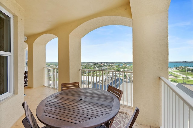 3343 S Atlantic Ave Unit 601, Daytona Beach Shores, FL 32118 - balcony featuring a water view and outdoor dining space