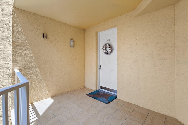 3343 S Atlantic Ave Unit 601, Daytona Beach Shores, FL 32118 - doorway to property featuring stucco siding and a balcony