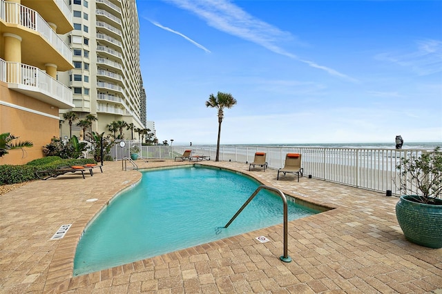 3343 S Atlantic Ave Unit 601, Daytona Beach Shores, FL 32118 - community pool featuring a patio area and a water view