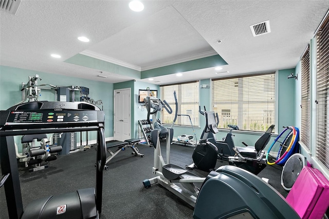 3343 S Atlantic Ave Unit 601, Daytona Beach Shores, FL 32118 - gym with crown molding, a textured ceiling, a raised ceiling, and recessed lighting