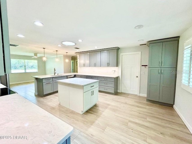 2017 Old Daytona Rd, Port Orange, FL 32128 - kitchen featuring a peninsula, healthy amount of natural light, light countertops, pendant lighting, and recessed lighting
