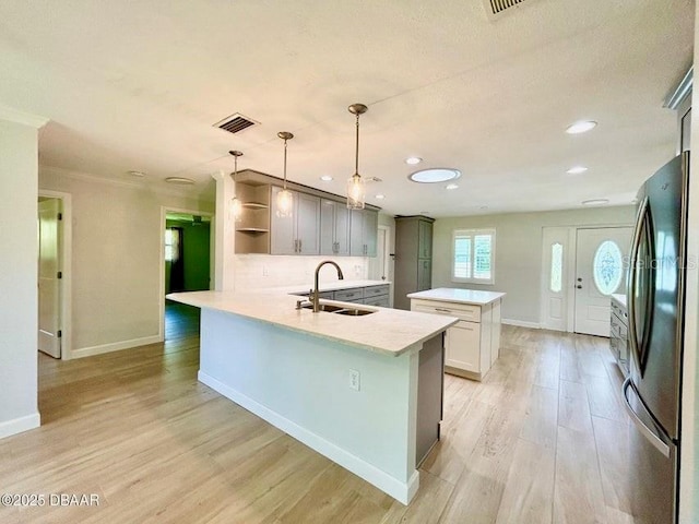 2017 Old Daytona Rd, Port Orange, FL 32128 - kitchen featuring freestanding refrigerator, open shelves, a peninsula, light wood-type flooring, and light countertops