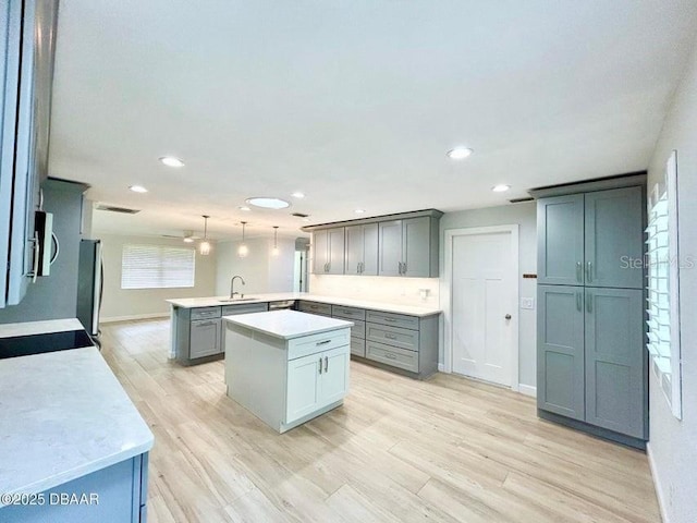 2017 Old Daytona Rd, Port Orange, FL 32128 - kitchen with appliances with stainless steel finishes, a peninsula, recessed lighting, light countertops, and pendant lighting