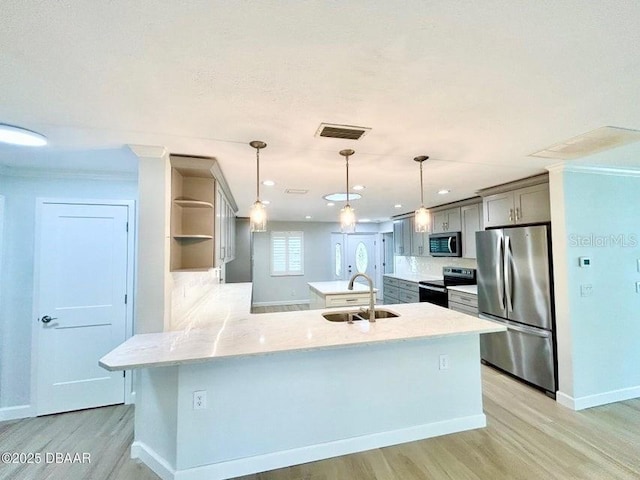 2017 Old Daytona Rd, Port Orange, FL 32128 - kitchen featuring stainless steel appliances, light wood finished floors, a peninsula, open shelves, and crown molding