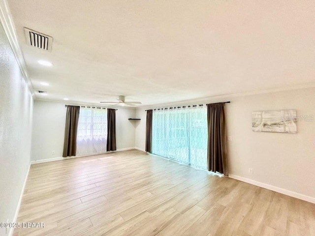 2017 Old Daytona Rd, Port Orange, FL 32128 - spare room featuring light wood-style floors, ceiling fan, crown molding, and recessed lighting