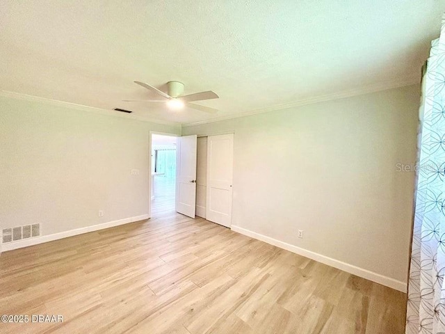 2017 Old Daytona Rd, Port Orange, FL 32128 - empty room with light wood-style floors, ceiling fan, ornamental molding, and a textured ceiling
