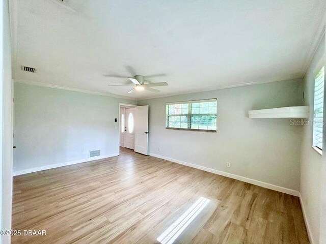 2017 Old Daytona Rd, Port Orange, FL 32128 - unfurnished room featuring ornamental molding, wood finished floors, and a ceiling fan