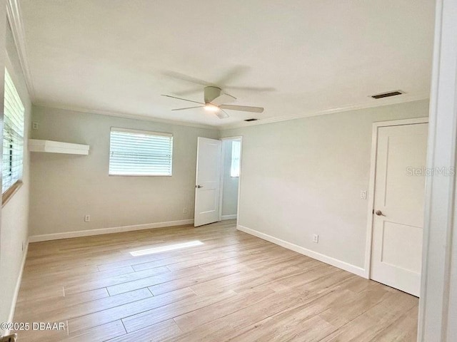 2017 Old Daytona Rd, Port Orange, FL 32128 - empty room with ceiling fan, light wood-style flooring, and ornamental molding
